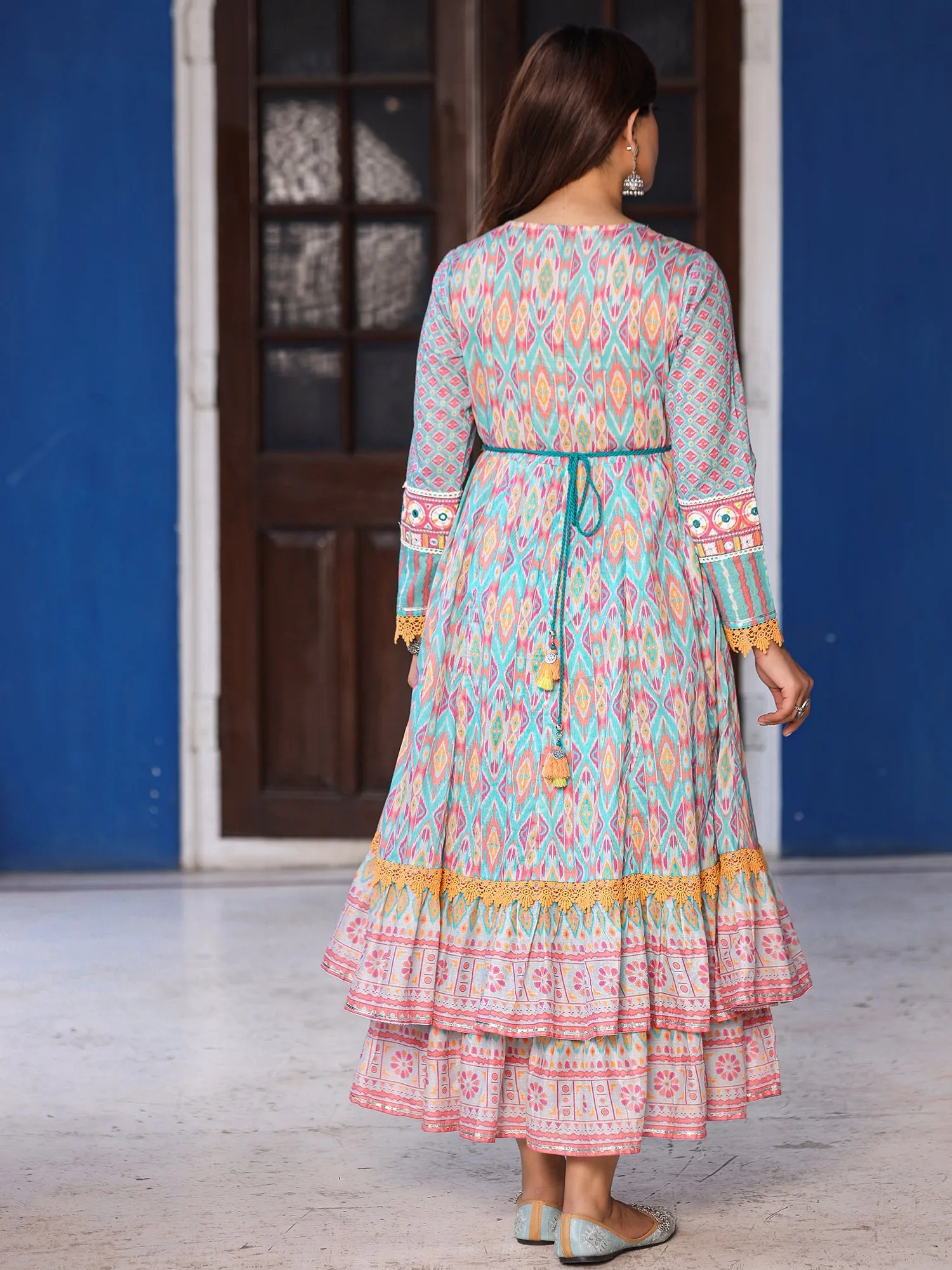 Jashvi Sky Blue Cotton Ikat Printed Maxi Dress With Thread Embroidery & Dori Tassel Tie-Up At Waist